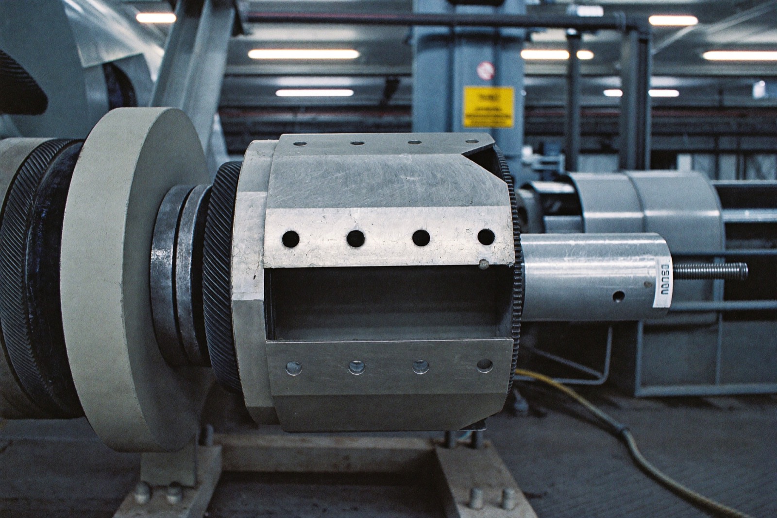 Industrial machinery with the guard housing open and its bolt holes empty